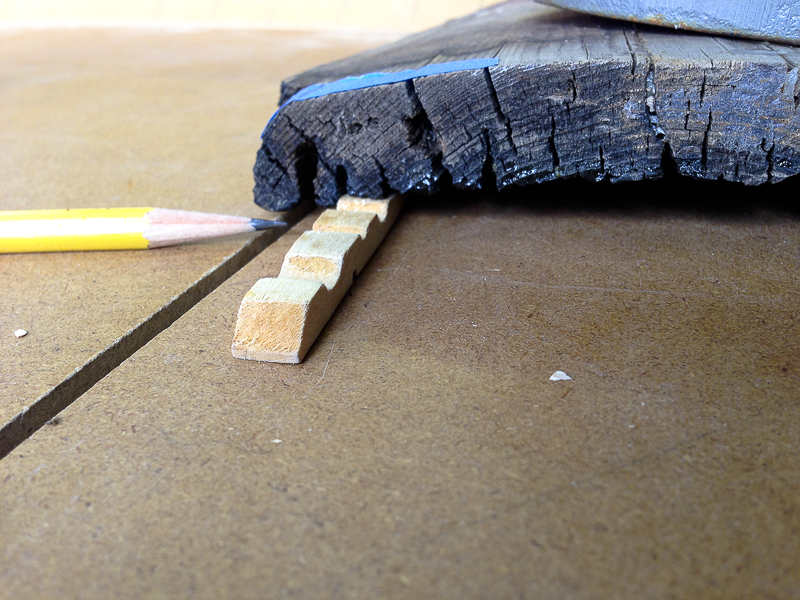 The above image shows a piece of wedged wood used to adjust the board